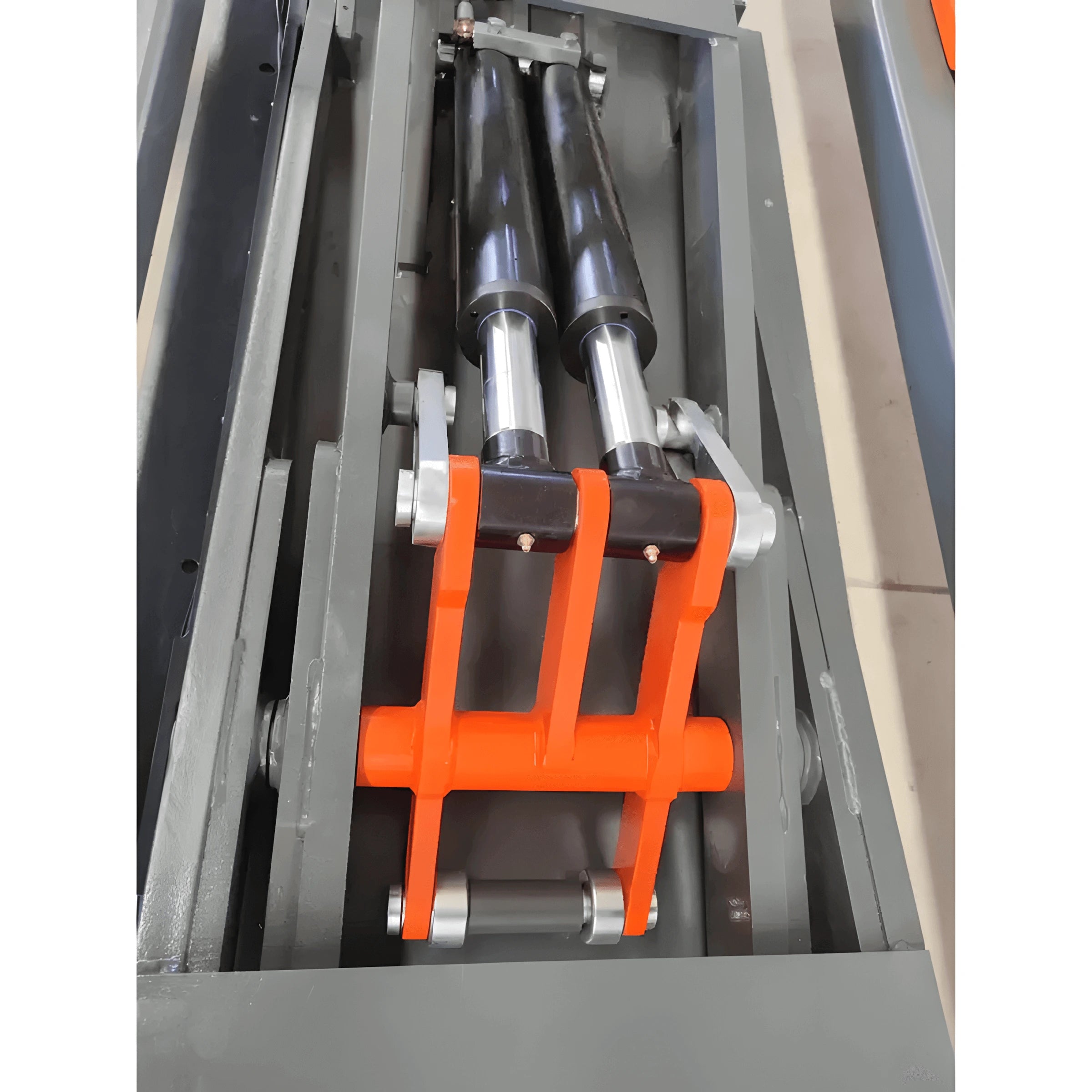 Katool KT-310 auto body frame machine close-up of the lifting mechanism showing dual hydraulic cylinders and orange support bracket within the platform assembly.