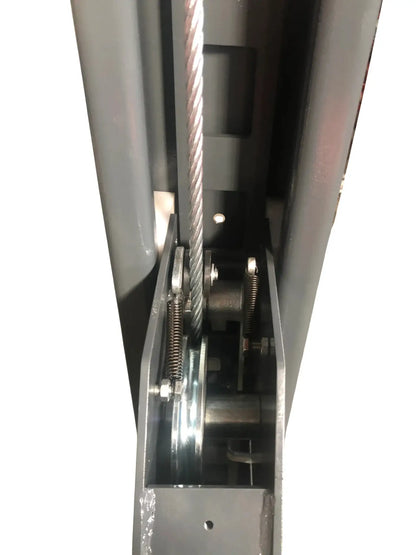 Katool KT-4H110 11,000 lb 4 post lift close-up of the internal column showing the steel cable, pulley system, tension springs, and roller mechanism inside the structural frame on a white background.