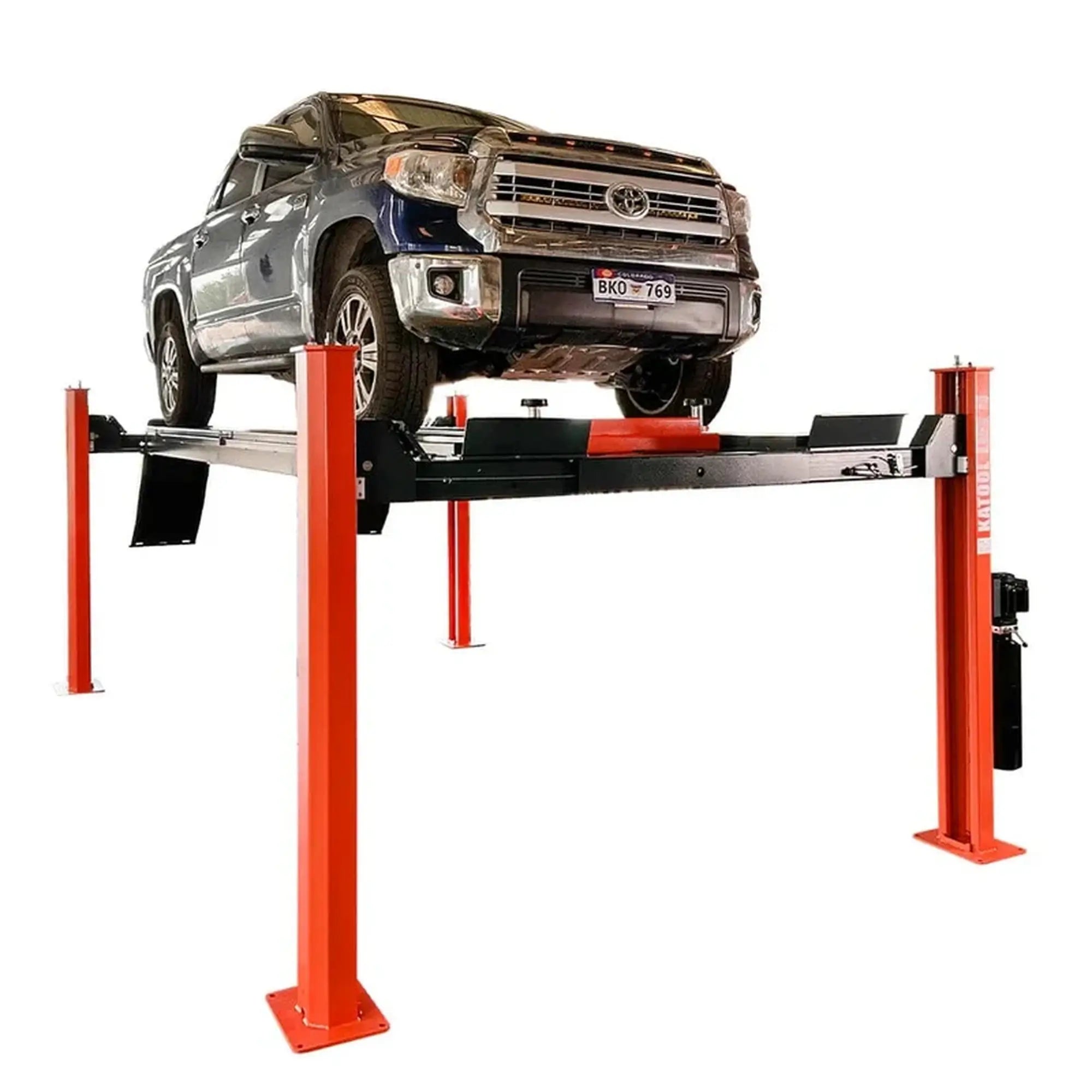 Katool KT-4H150 4 Post Alignment Lift shown at an angle with a full-size pickup truck raised on the runways, red steel posts and black platform visible on a white background.