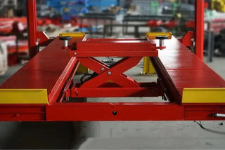 Katool KT-4H150 rolling bridge jack for 4 post lift positioned between runways with scissor lift mechanism