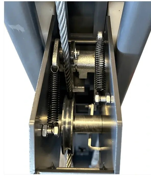 Katool KT-4H850 4-Post Car Lift close-up of column mechanism with steel cable, pulley sheave, return springs, and safety lock parts inside the post.