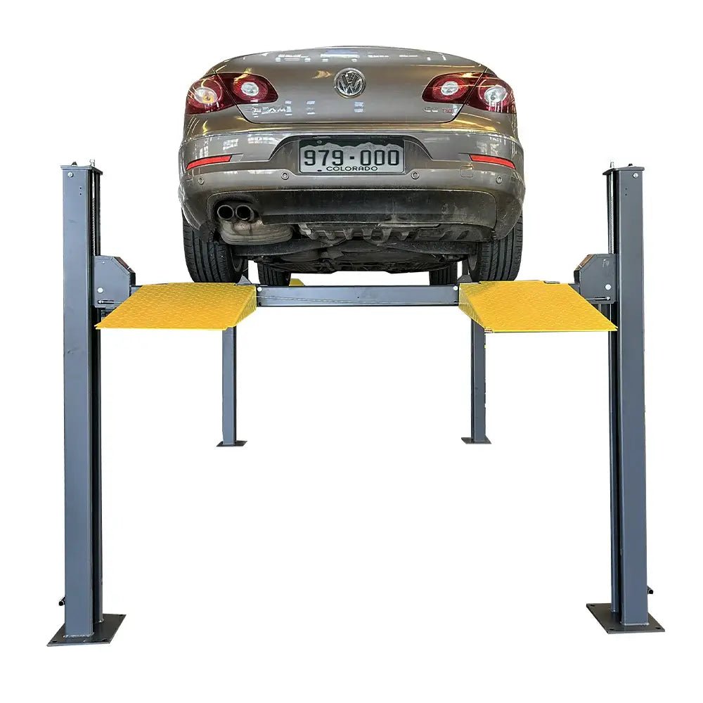 Katool KT-4H850 4-Post Car Lift shown with a Volkswagen sedan positioned on the dual runways, featuring yellow ramps and steel posts against a white background.