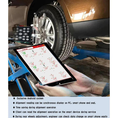 Katool KT-AV651 wheel alignment machine showing tablet display with real-time alignment readings and Android interface beside mounted wheel targets