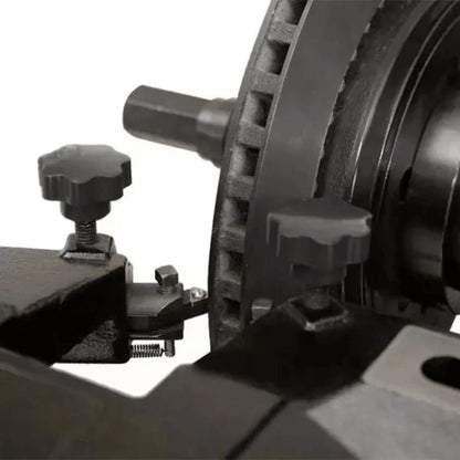 Katool RL-8500 brake lathe closeup showing cutting bit in contact with vented rotor surface, adjustable tool knobs, and precision feed mechanism for fine machining.
