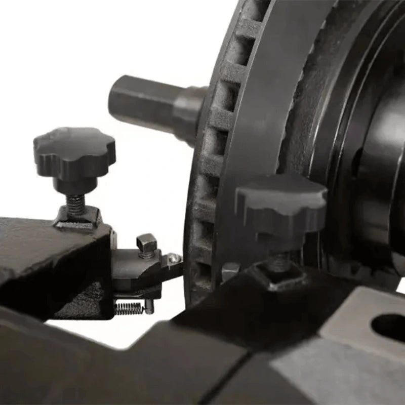 Katool RL-8500 brake lathe closeup showing cutting bit in contact with vented rotor surface, adjustable tool knobs, and precision feed mechanism for fine machining.