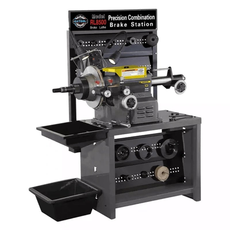 Katool RL-8500 brake lathe, front three-quarter hero view showing control levers, precision head, chip tray, adapter rack, and removable drain pan.