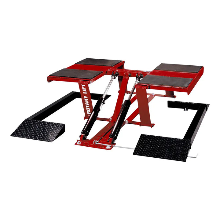 Hydraulic car lift with red frame and black platforms for vehicle maintenance.