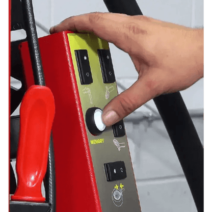 Person’s hand operating Rotary R1250 Leverless Tire Changer control panel with glowing button