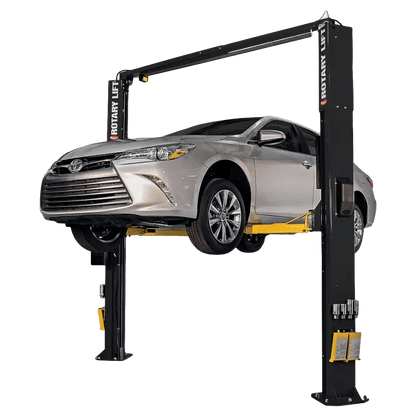 Two-post asymmetrical lift holding a silver Toyota Camry on Rotary SPOA10 10K