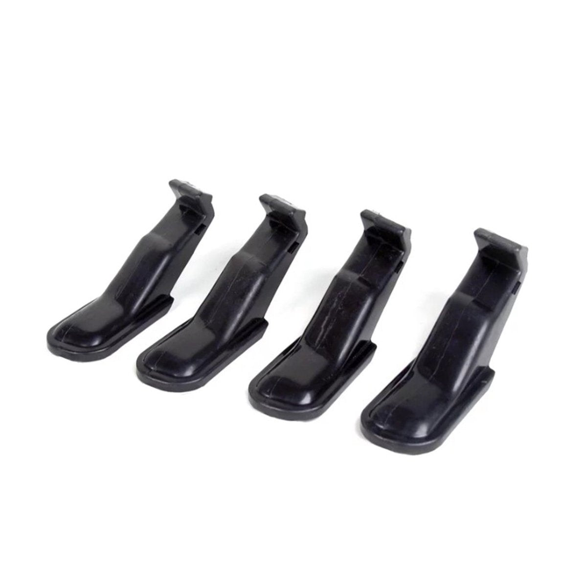 Four black jaw covers arranged in a row