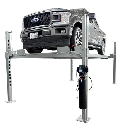 Ford F-150 truck lifted on Triumph NOS10000 4 post car lift, front angle with rolling jack